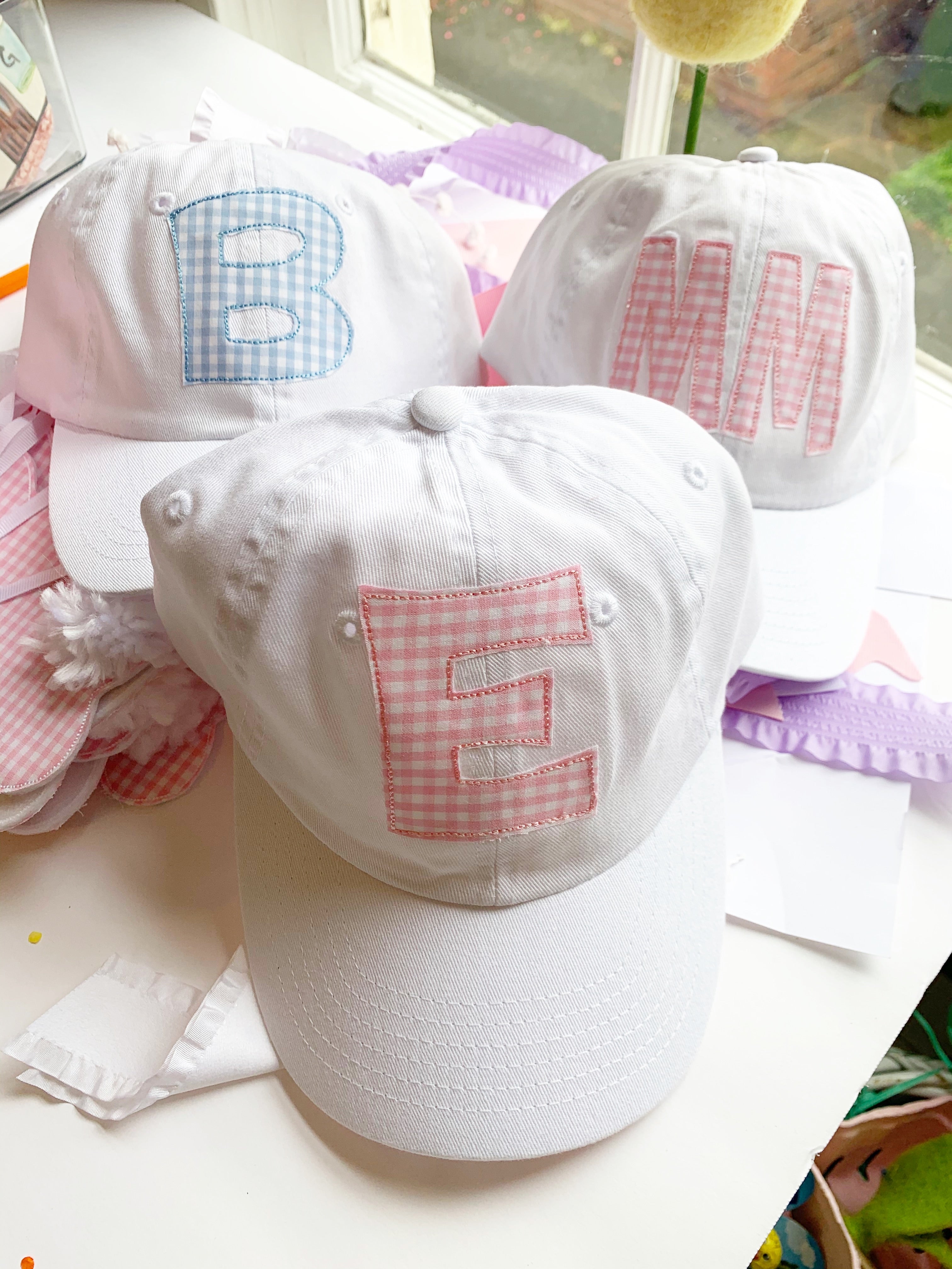Initial White Hat in pink and blue